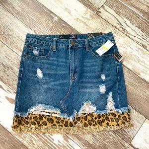 Distressed Denim mini skirt with leopard detail. BBJ women’s size Medium. NWT.